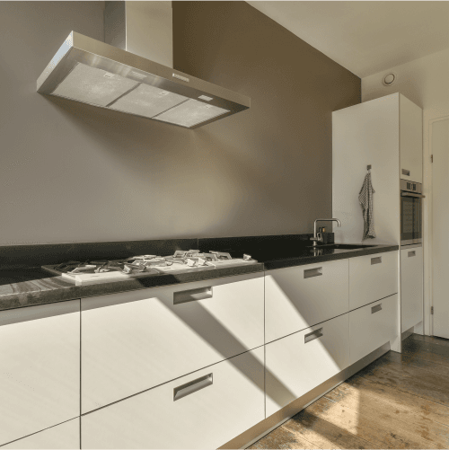 Empty kitchen cleaning with chimney